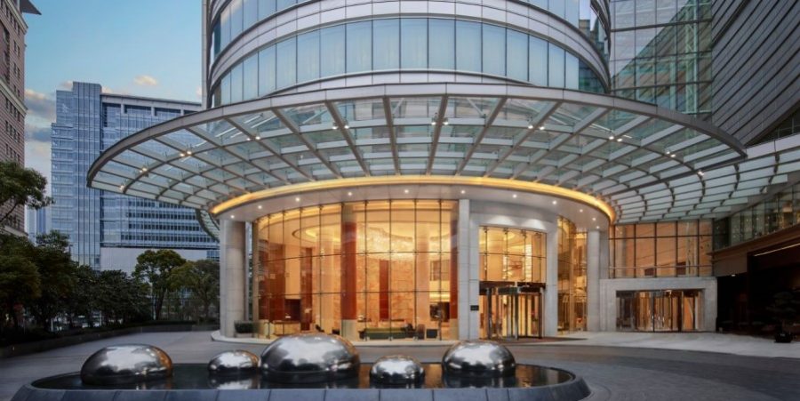 A luxury hotel featuring modern architecture and stunning views of the city skyline.